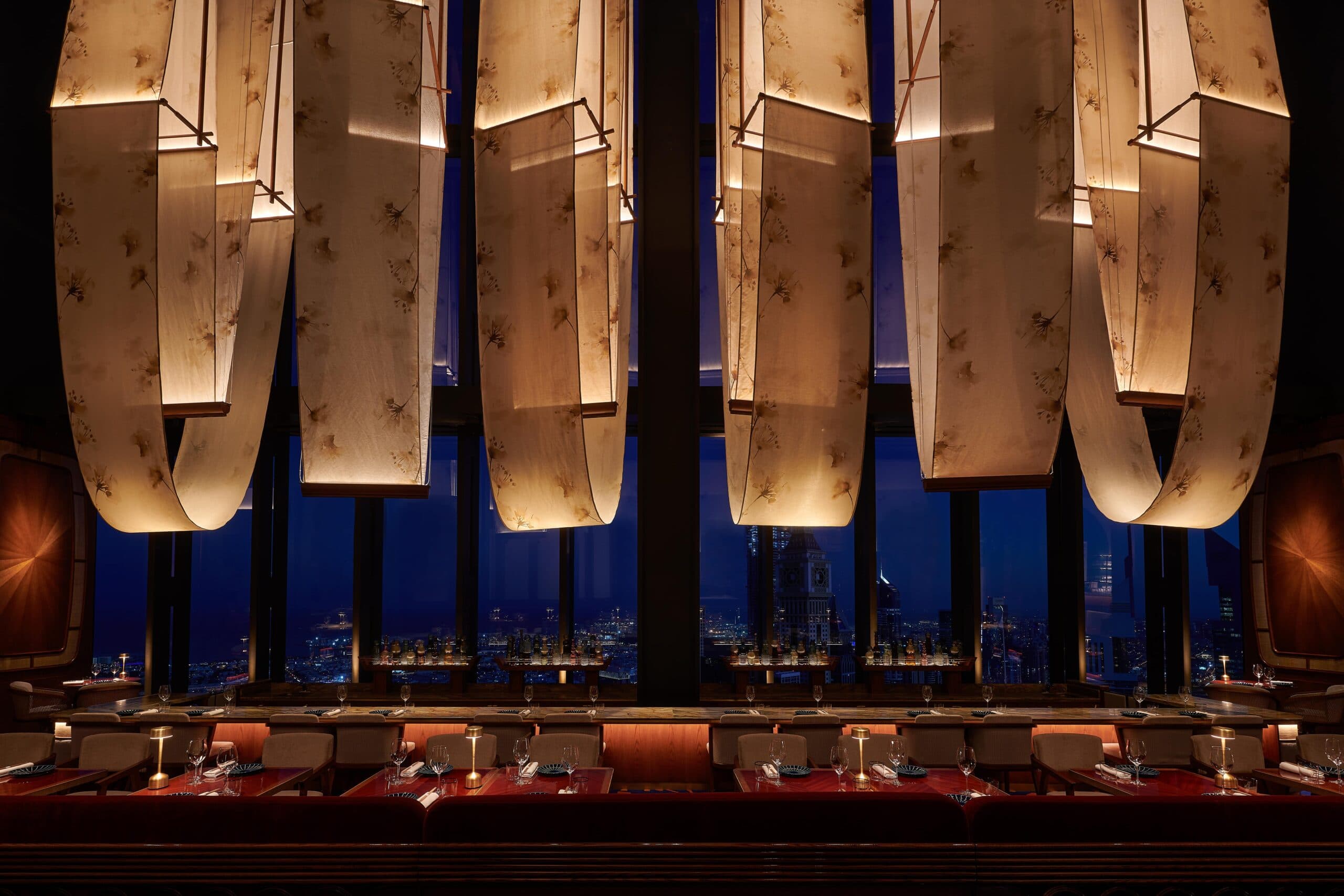 Bar des Prés dining room overlooking Dubai at night